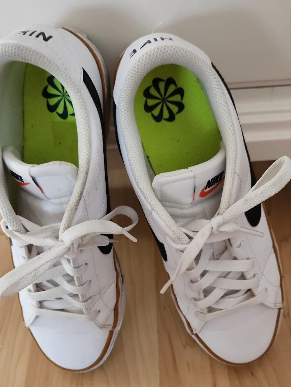 Nike White Leather Sneakers with Black Swoosh and Gum Trim